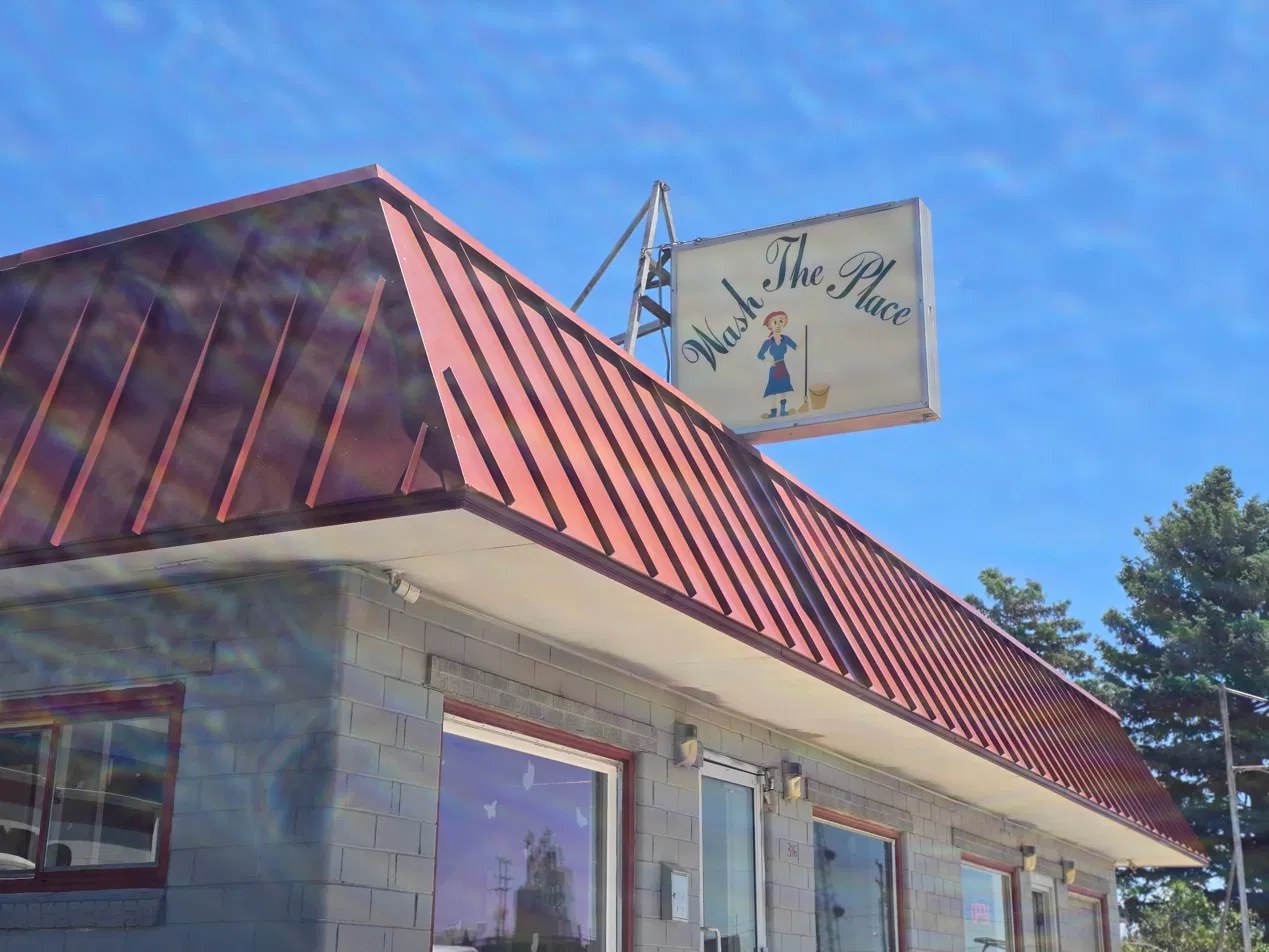 Wash The Place sign — the laundromat at 316 Elm Street