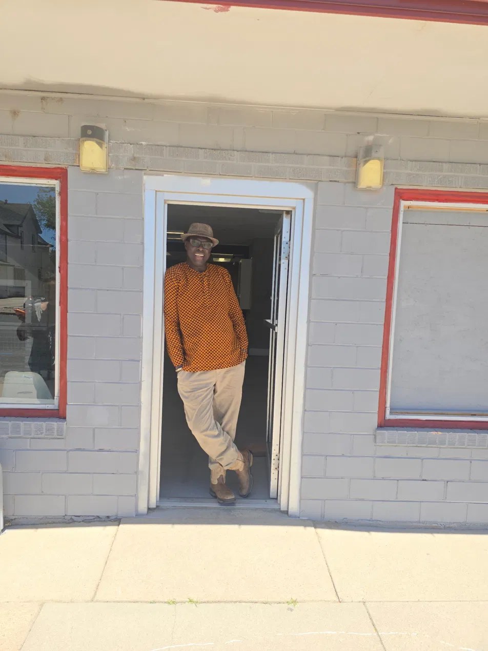 Yemane Habtezgi at the entrance to 316 Elm Street